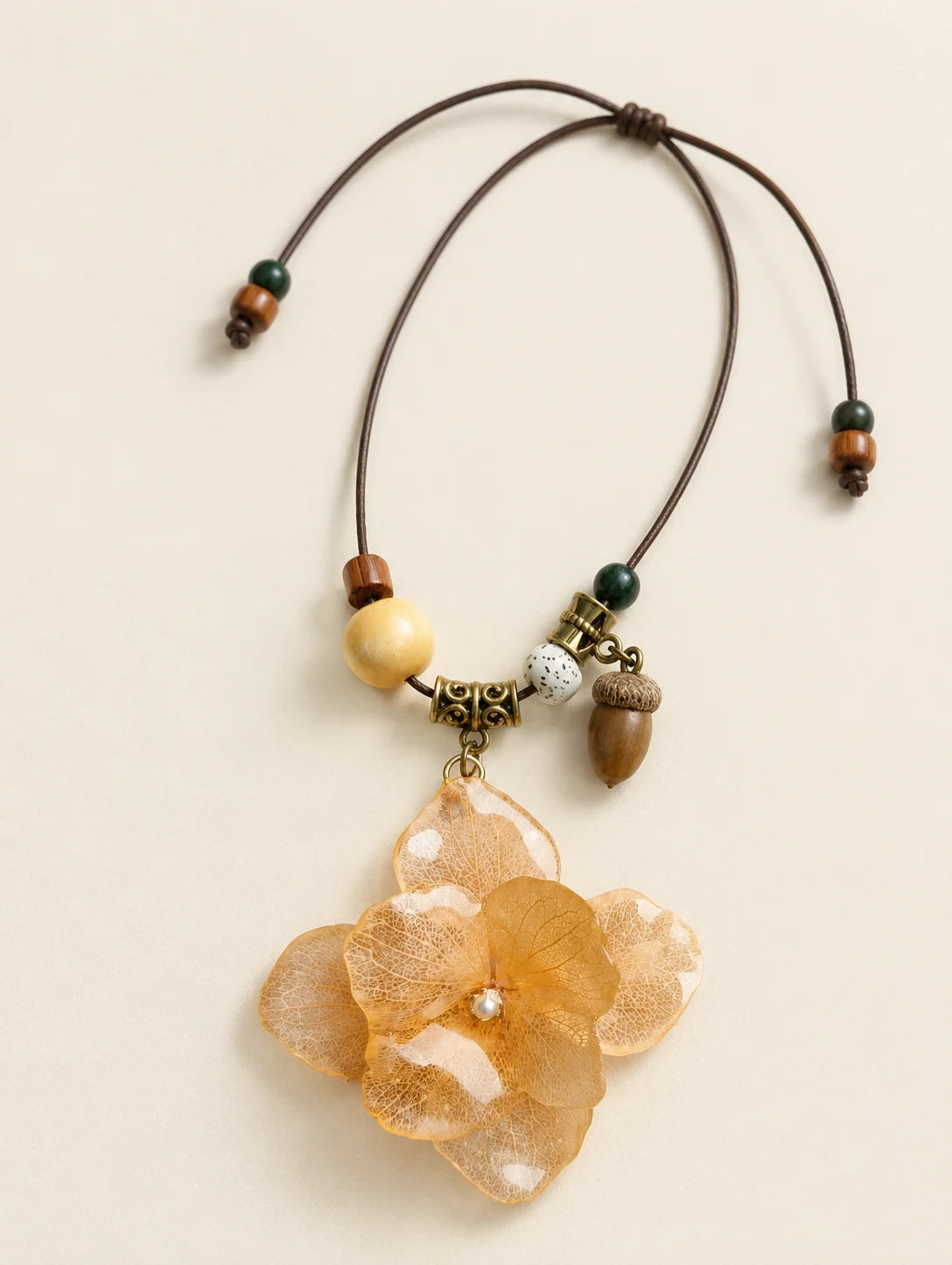 Champagne Petal Cluster Necklace — complete product view on a warm ivory background