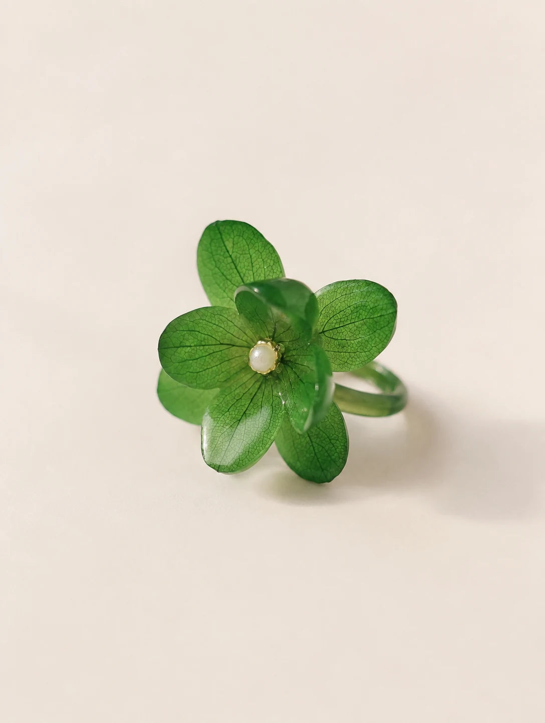 Forest Green Petal Cluster Ring — complete product view on a warm ivory background