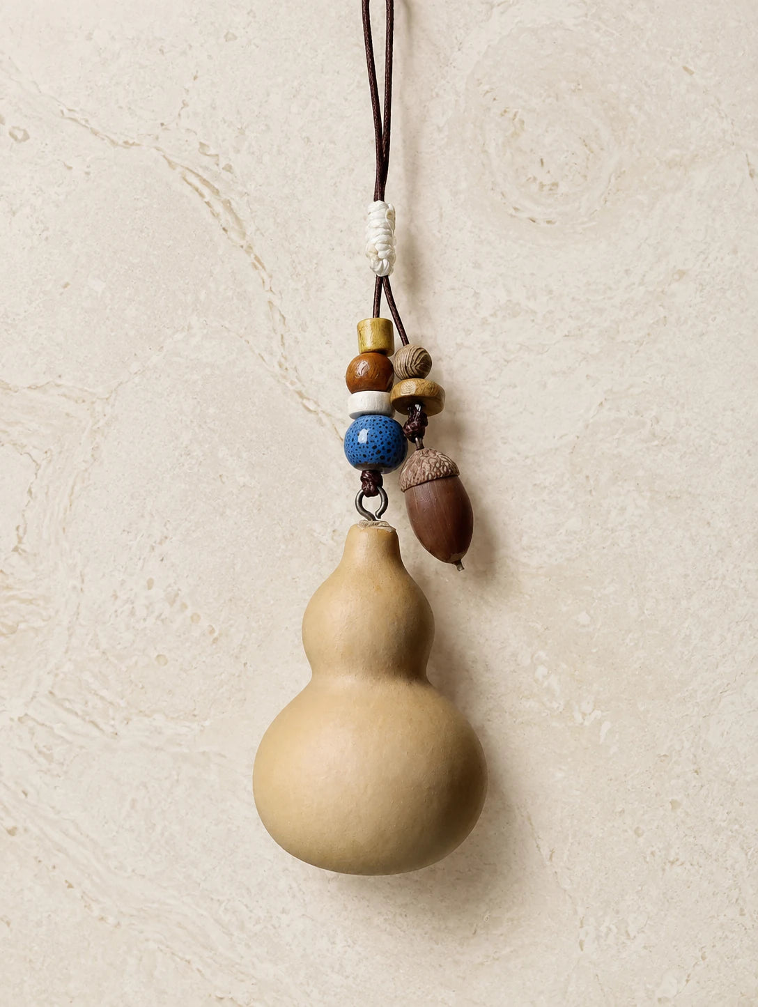 Gourd and Seed Phone Charm — detail view