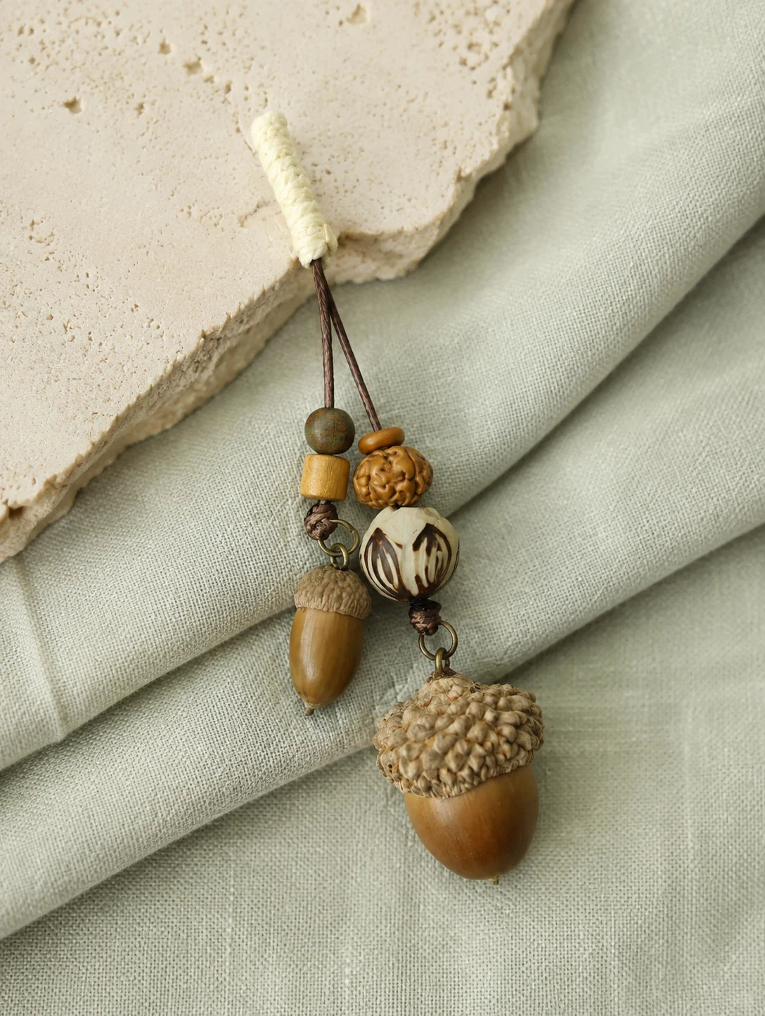 Double Woodland Seed Pendant Necklace — styled view