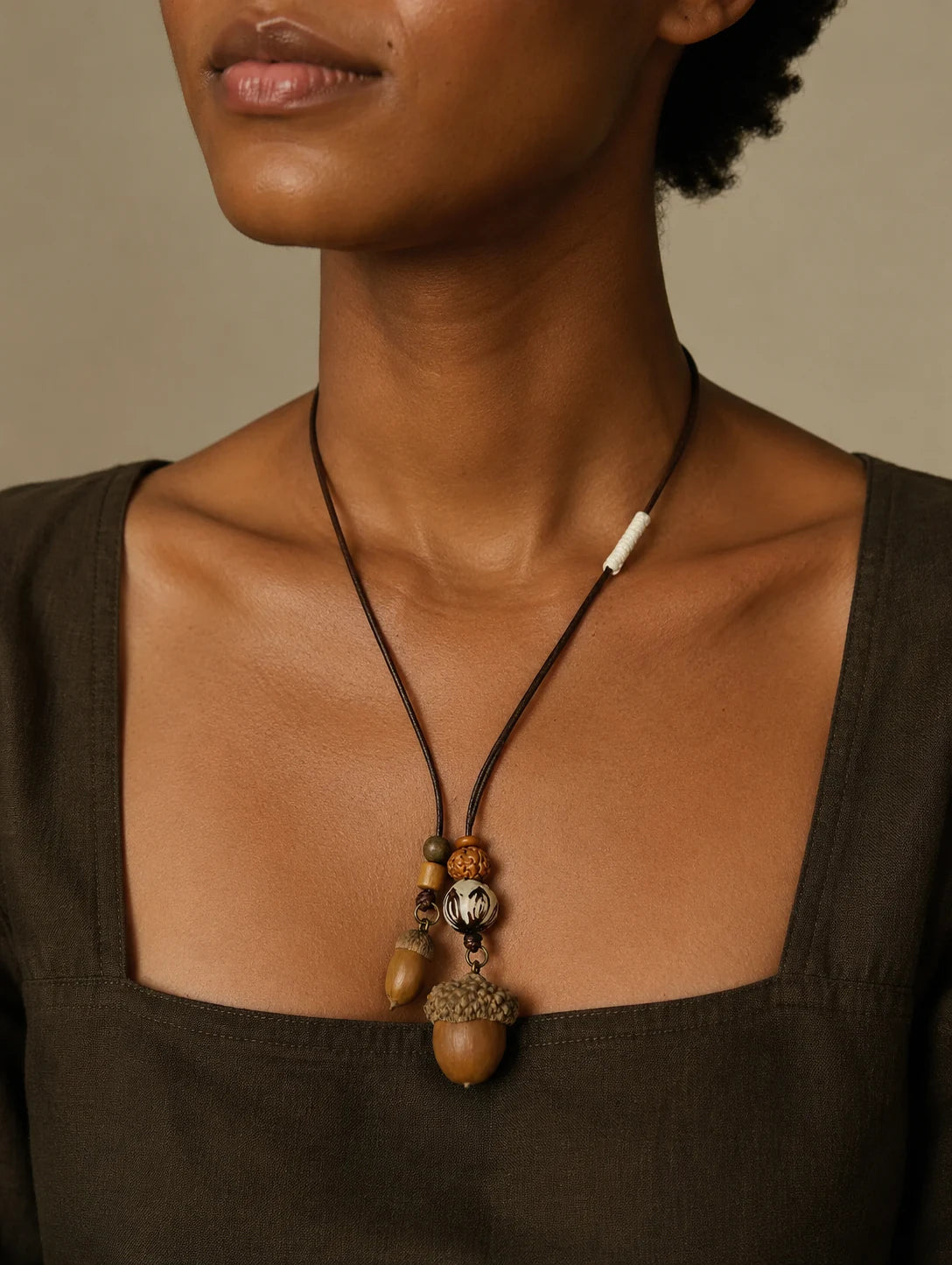 Editorial model styling the Double Woodland Seed Pendant Necklace