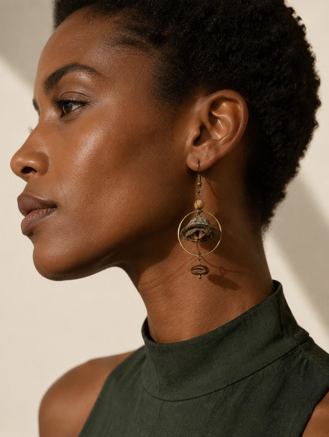 Editorial model styling the Bell Pod and Bean-Silhouette Earrings