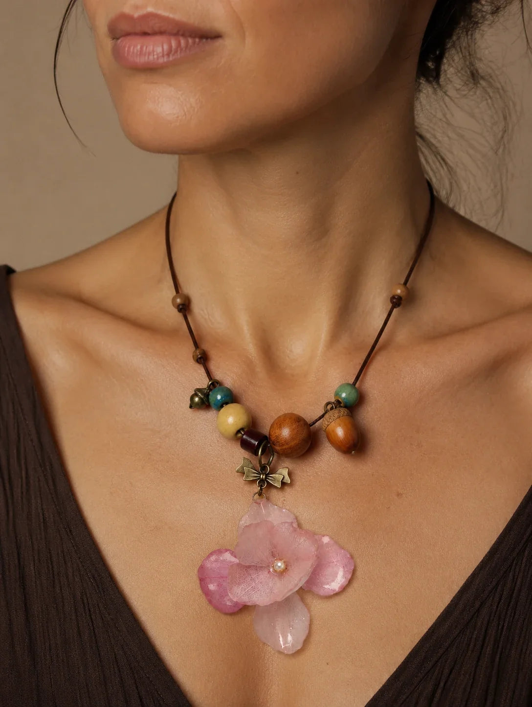 Editorial model styling the Blush Petal Cluster Necklace
