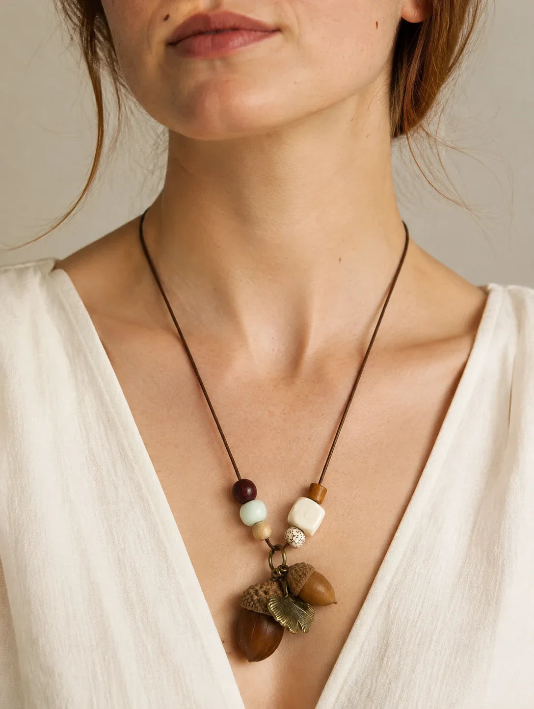 Editorial model styling the Brown Acorn-Silhouette Necklace