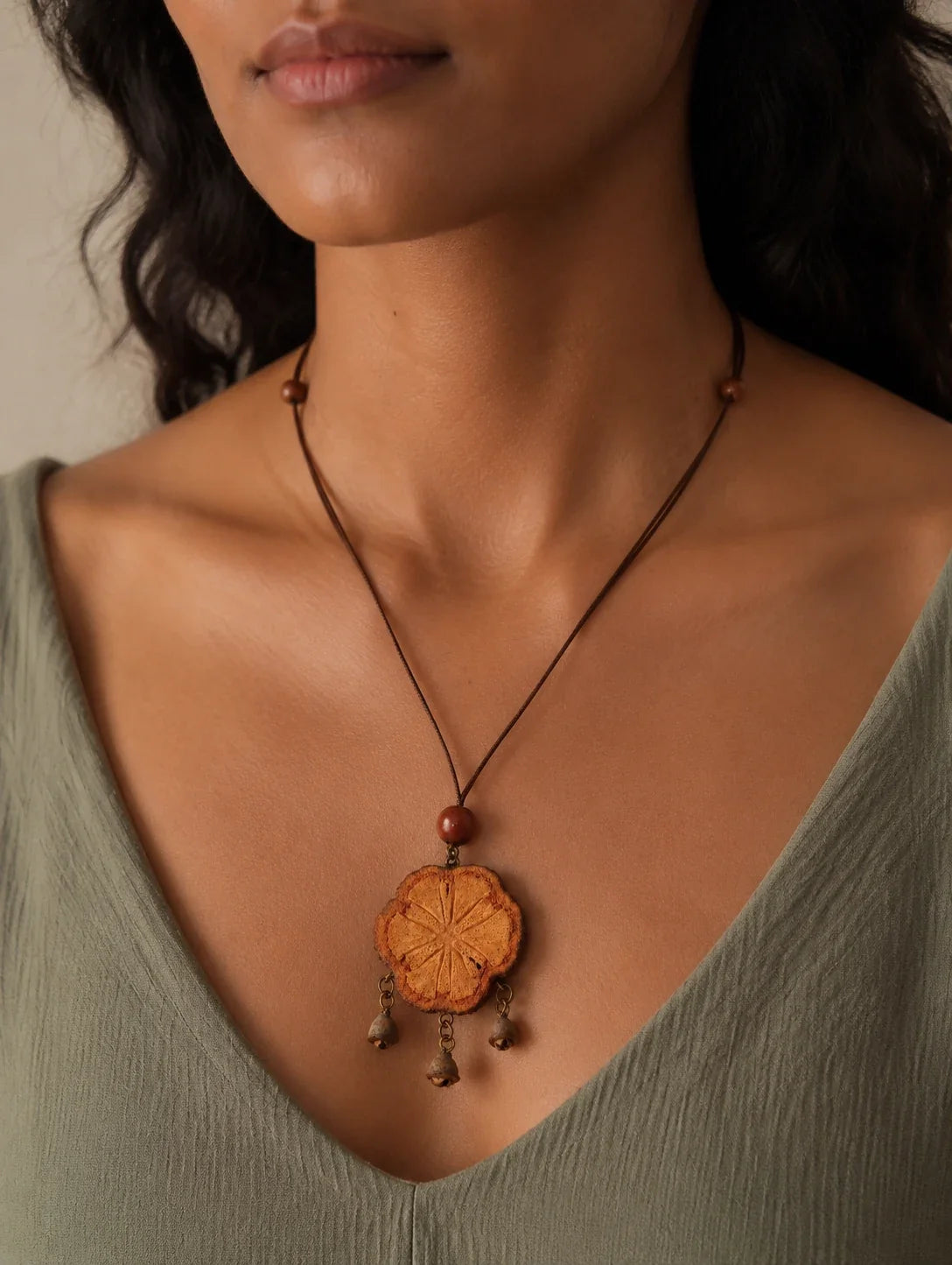 Editorial model styling the Textured Woodland Tassel Necklace