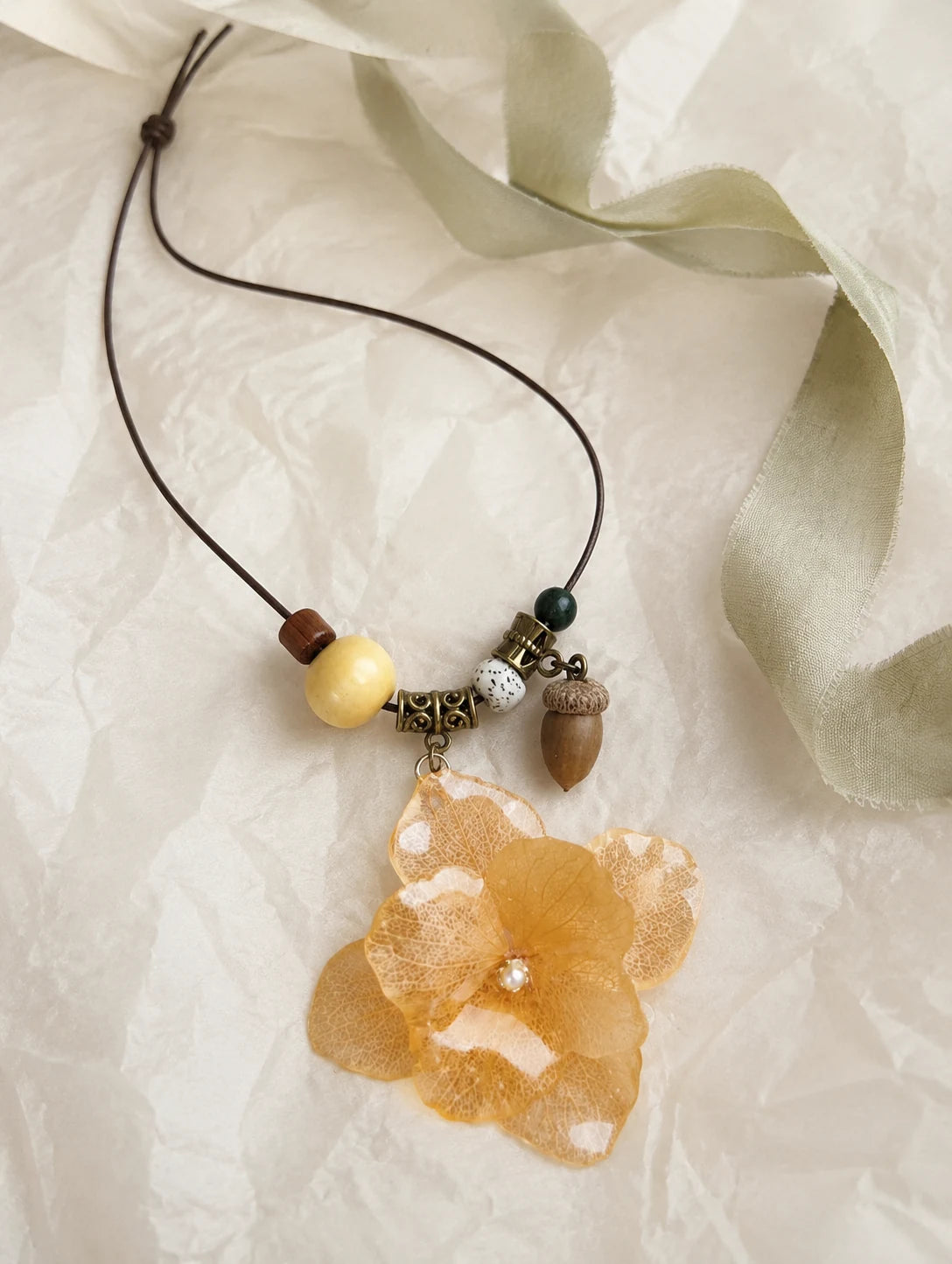 Champagne Petal Cluster Necklace — unbranded gift-context still life
