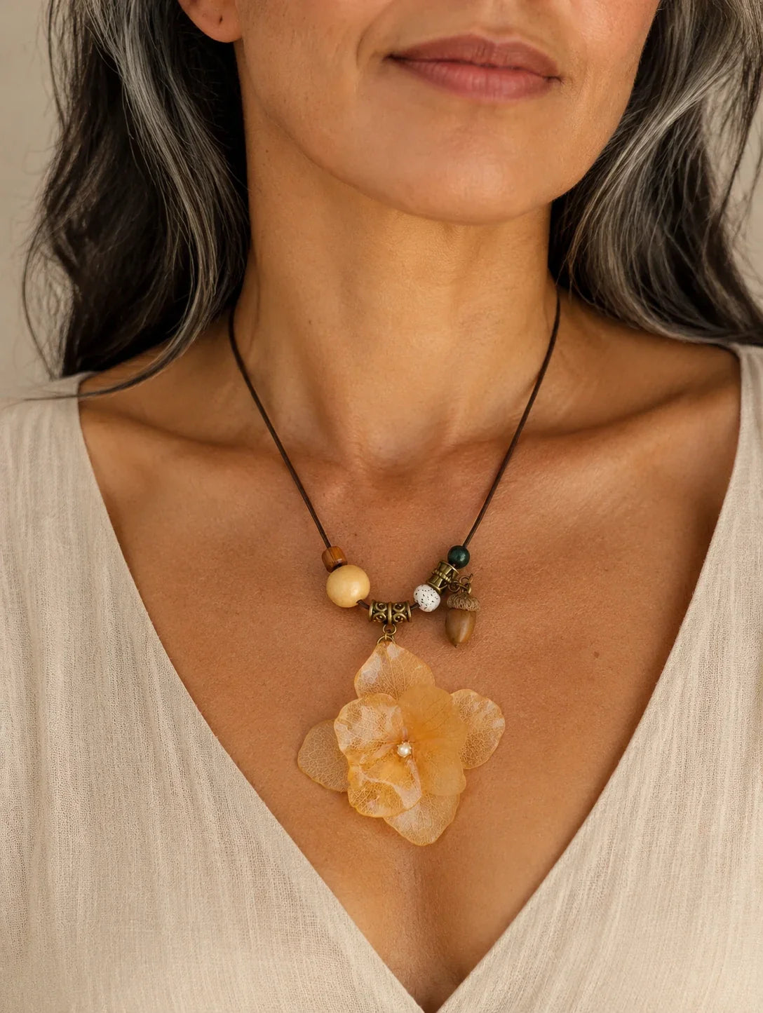 Editorial model styling the Champagne Petal Cluster Necklace