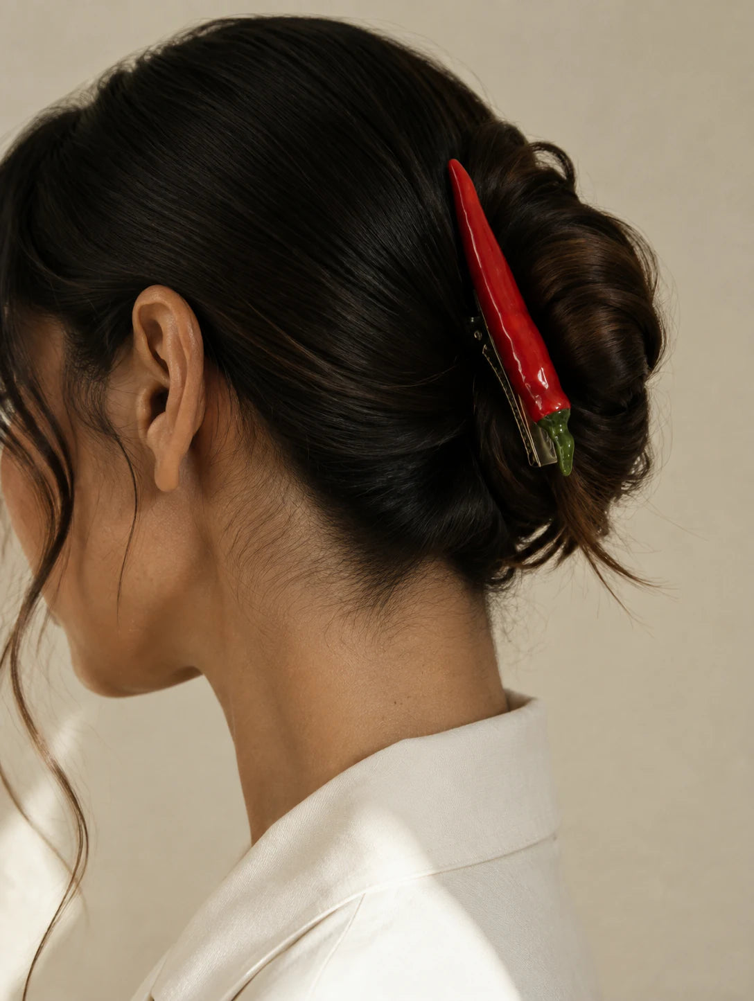 Editorial model styling the Red Pod Hair Clip