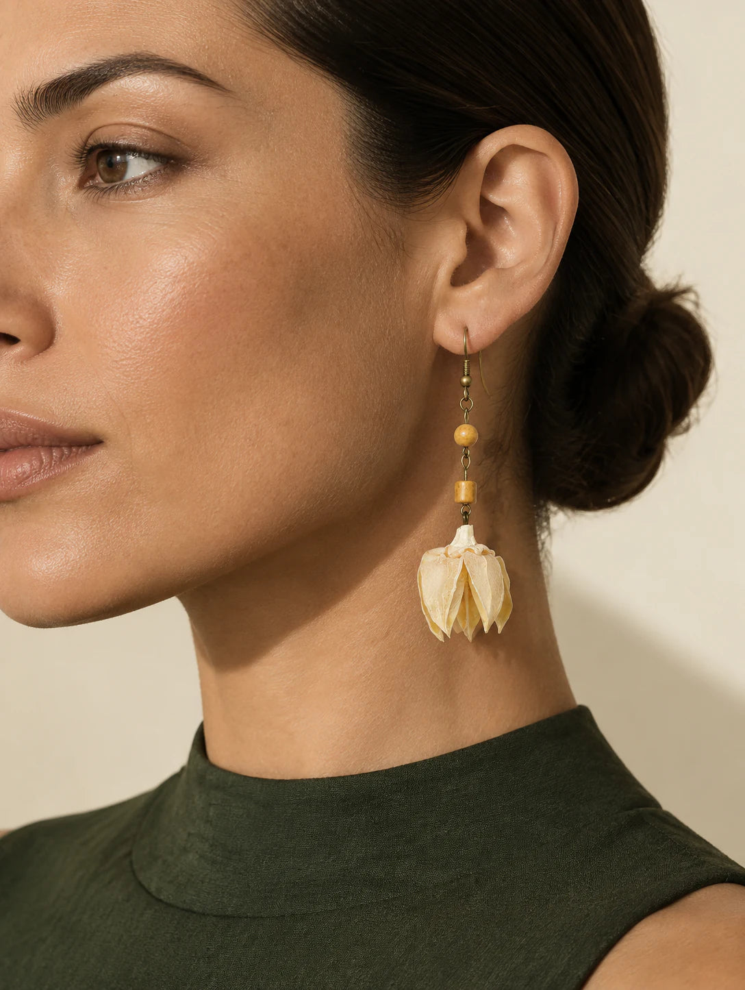 Editorial model styling the Textured Husk Drop Earrings