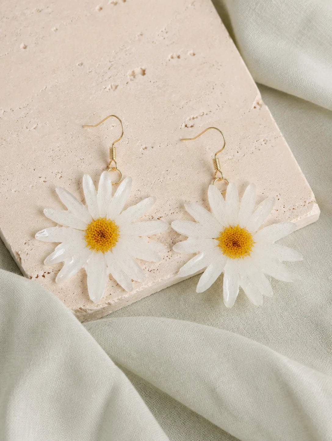 Cream Petal Drop Earrings — styled view