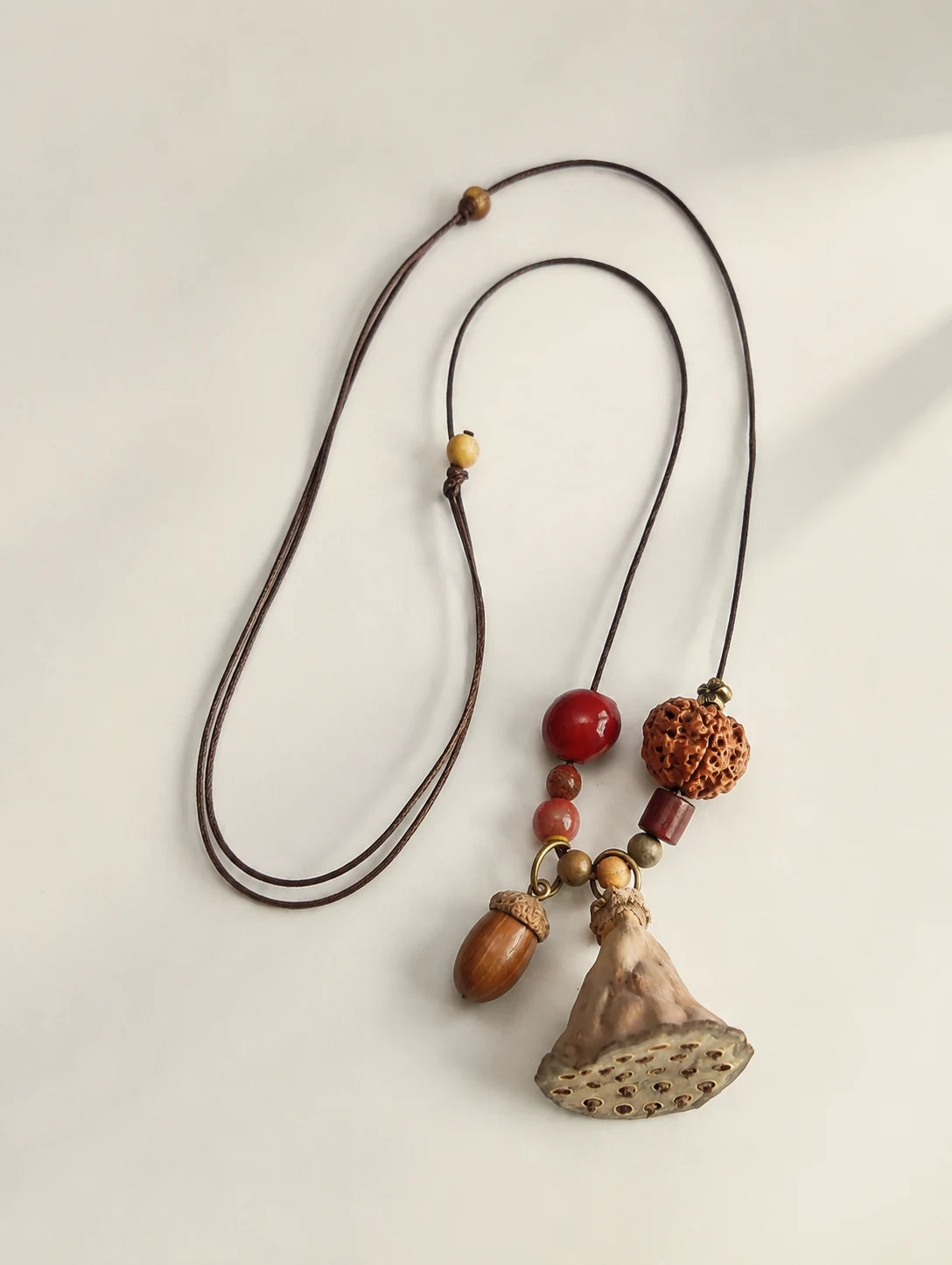 Fan Pod and Acorn Necklace — second product angle
