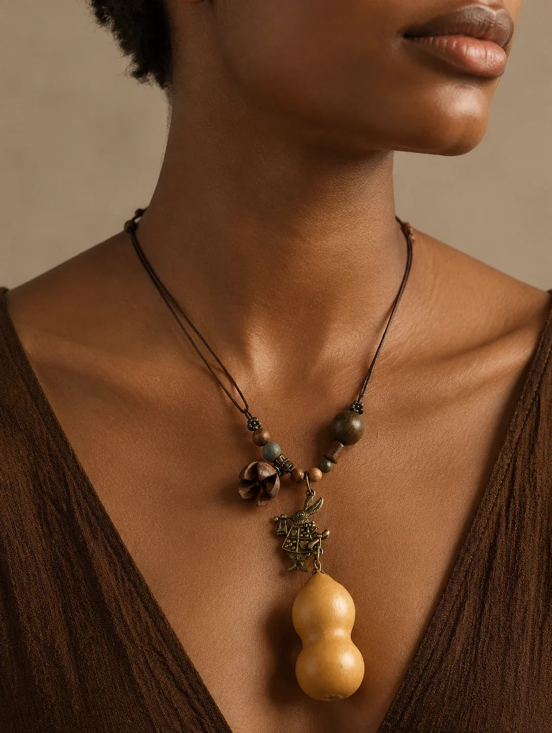 Editorial model styling the Golden Gourd-Silhouette Necklace