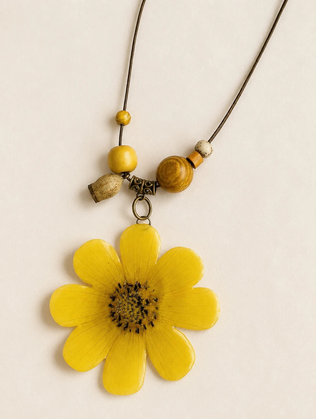 Golden Petal Pendant Necklace — close detail view