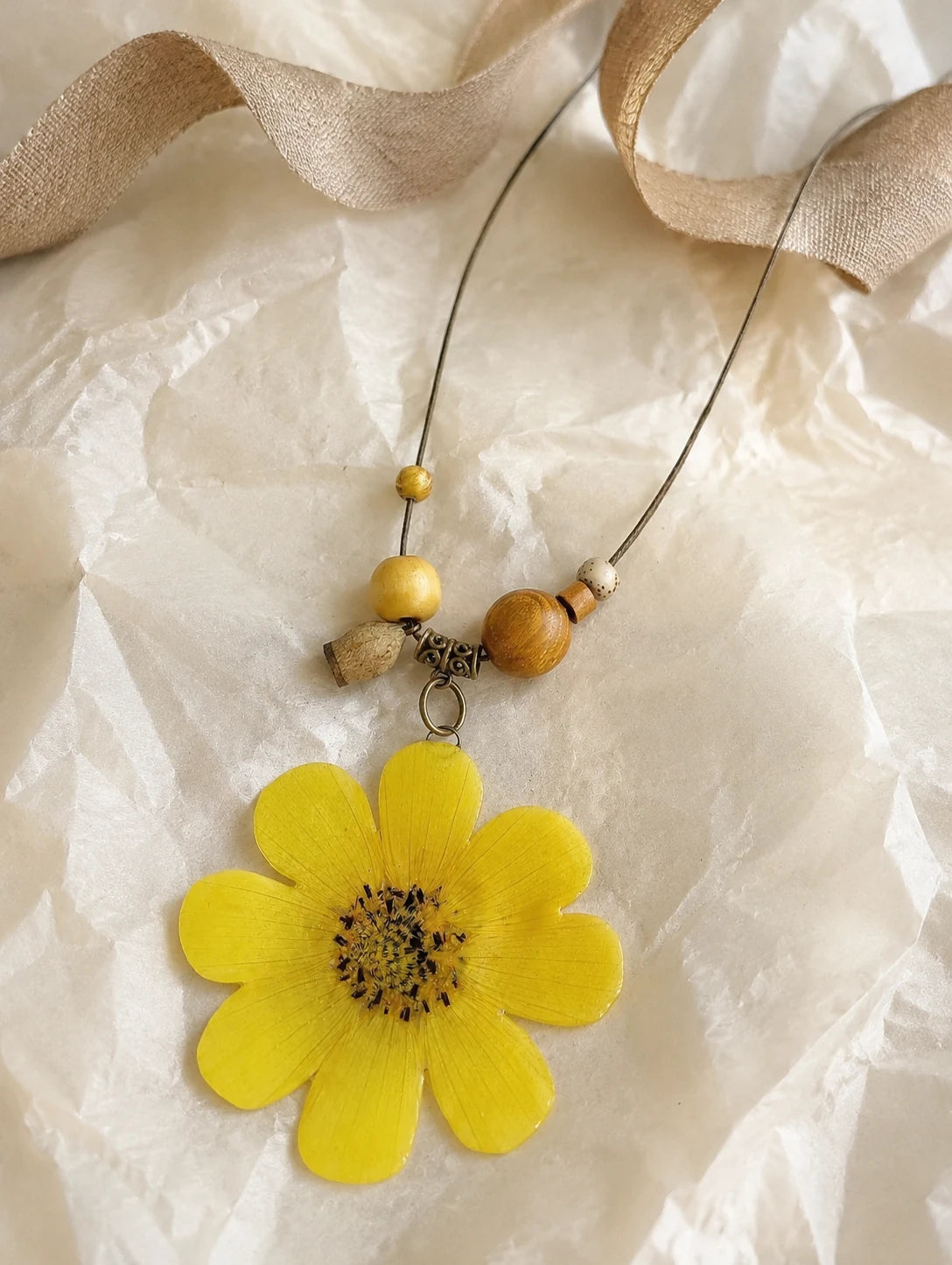 Golden Petal Pendant Necklace — unbranded gift-context still life