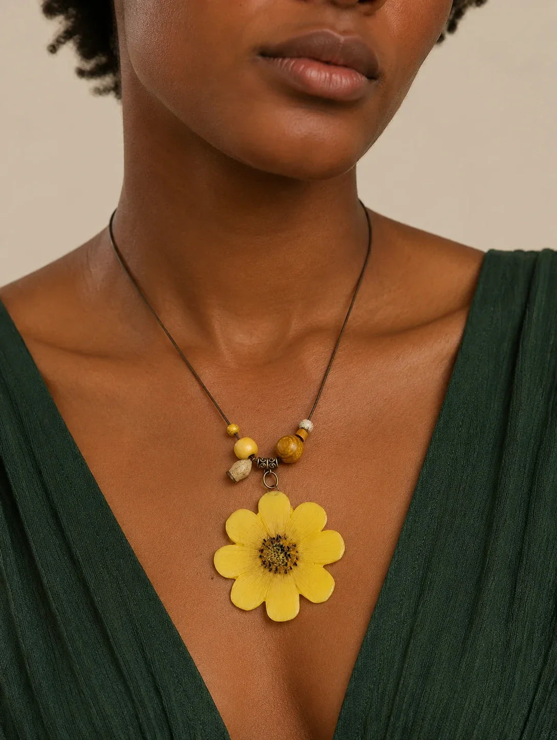 Editorial model styling the Golden Petal Pendant Necklace