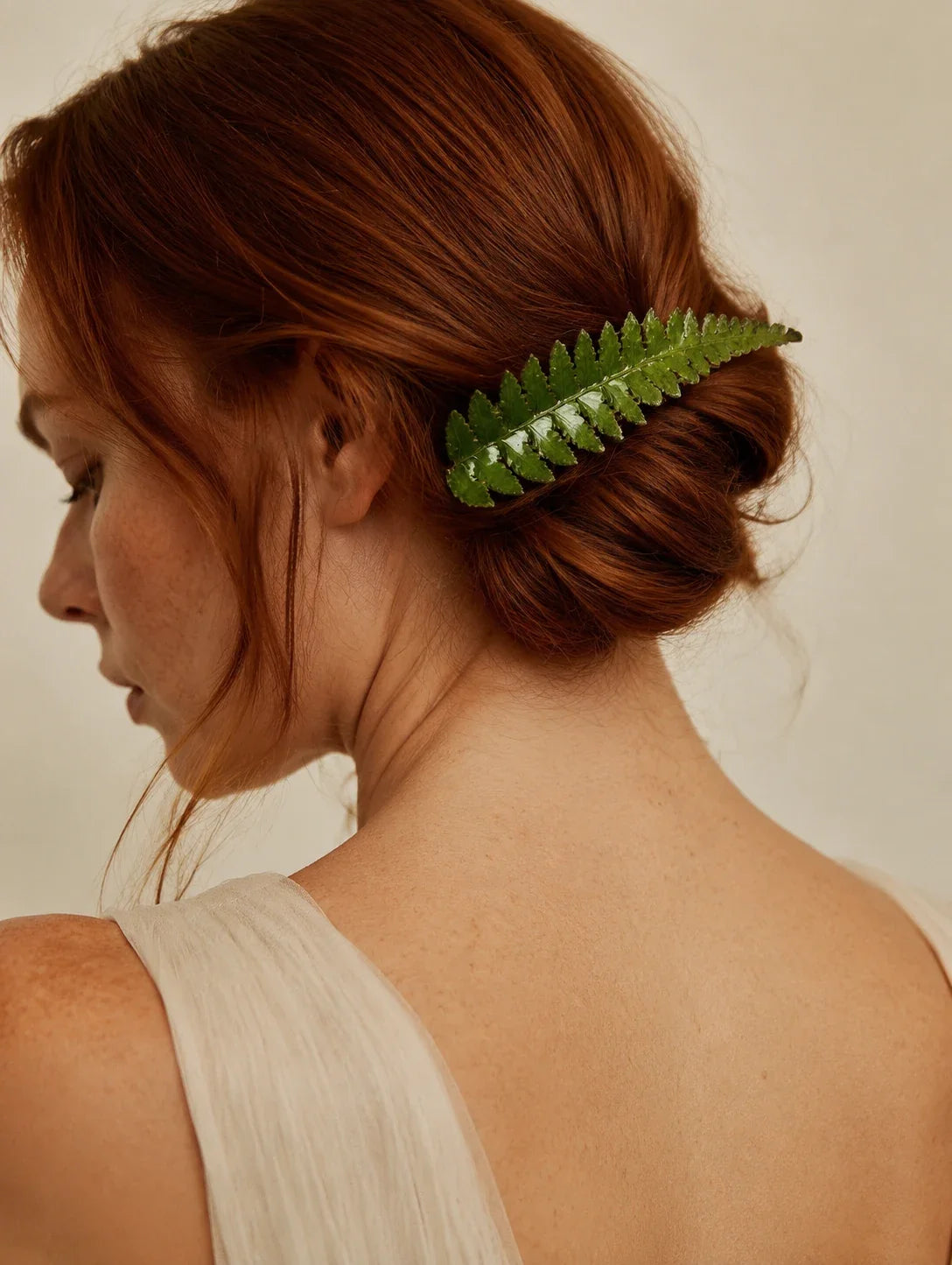 Editorial model styling the Green Frond Hair Clip