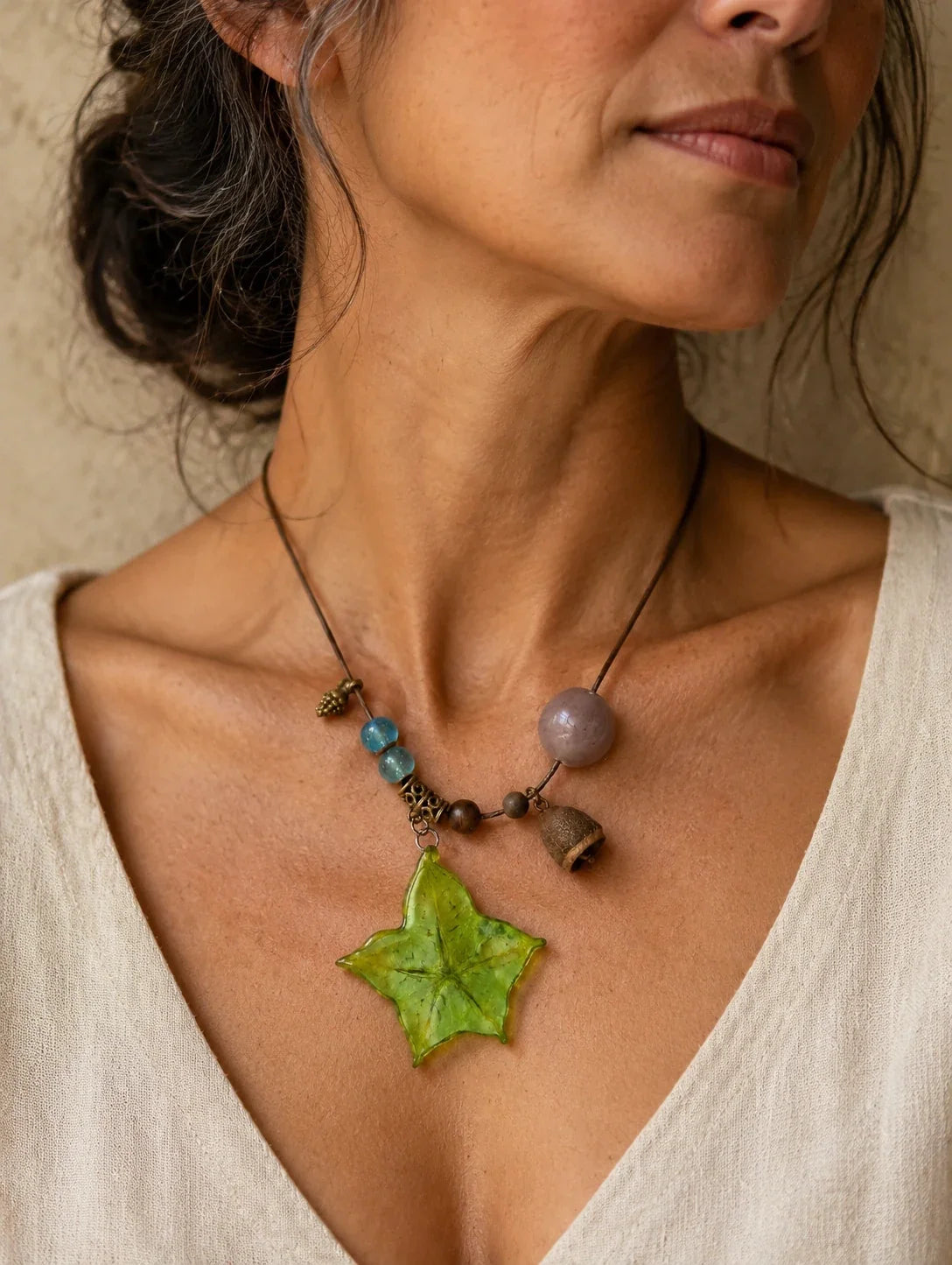 Editorial model styling the Green Star Slice Necklace