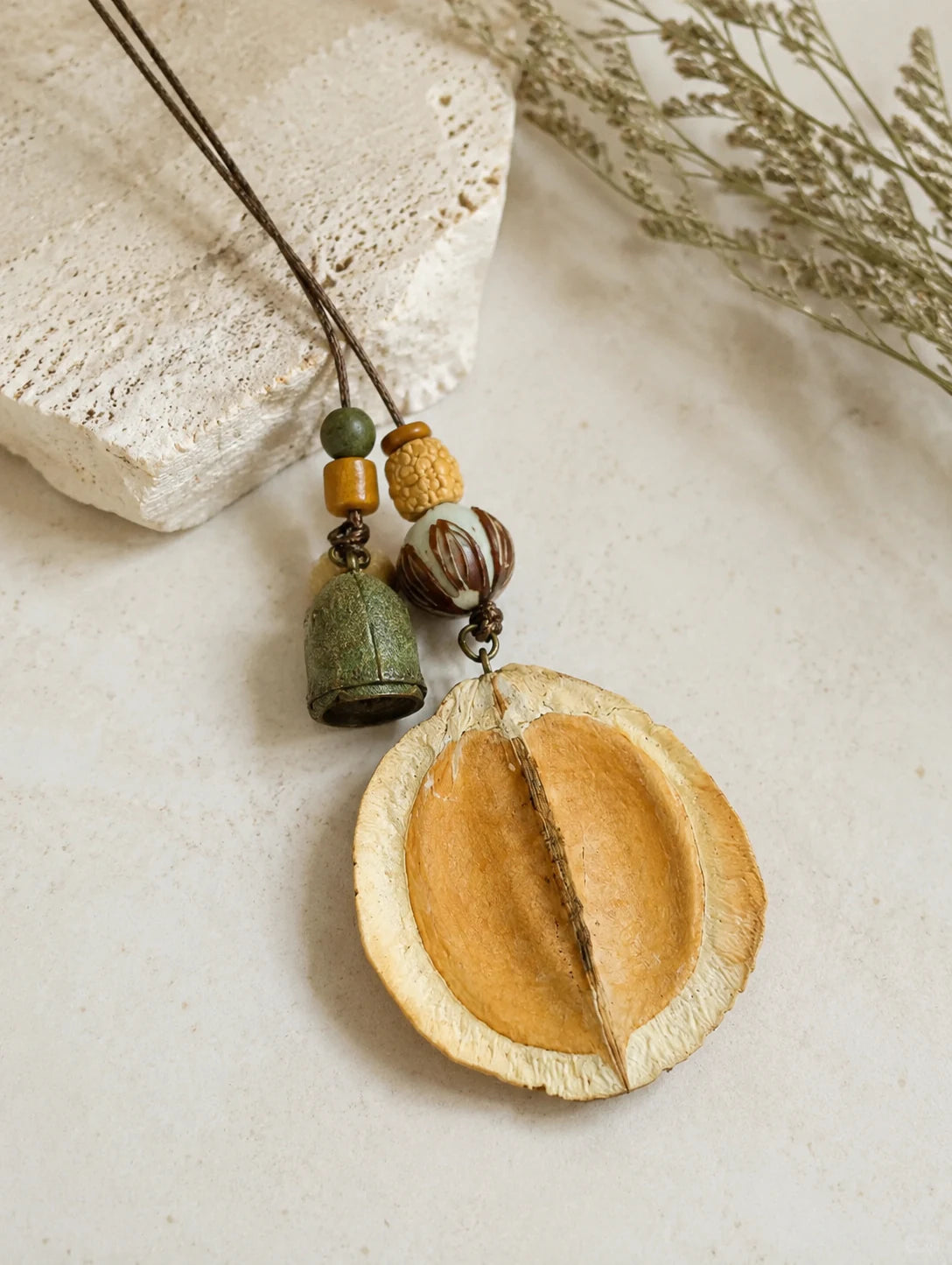 Curved Seed-Pod Pendant Necklace — detail view