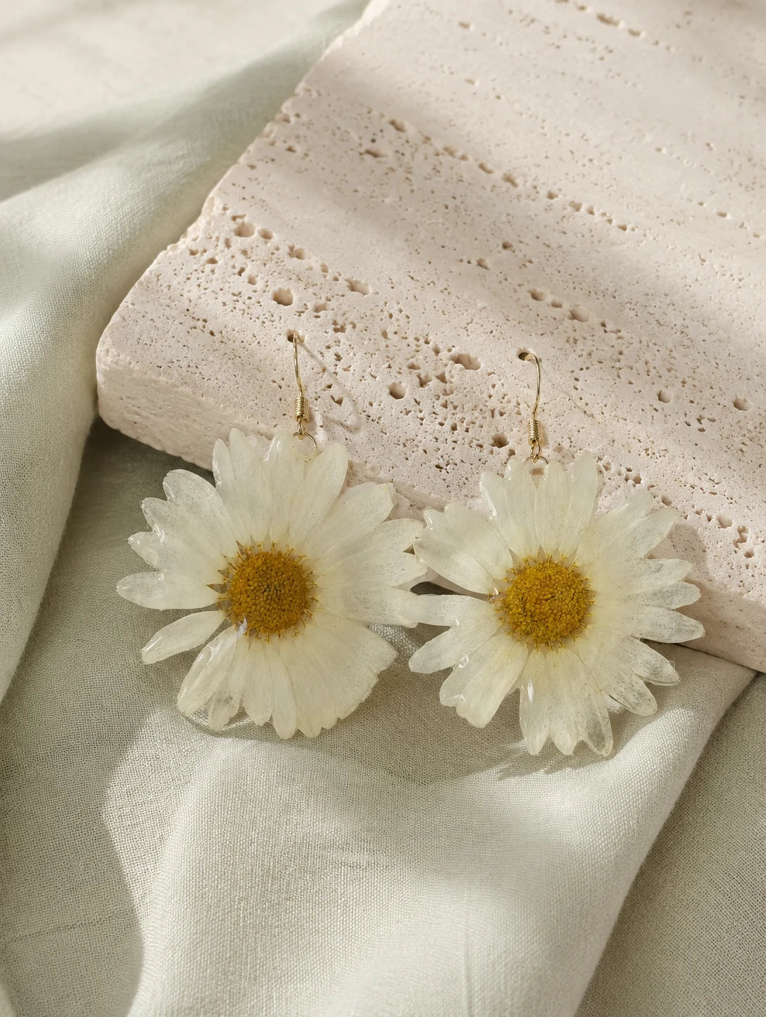 Large White Petal Drop Earrings — styled view