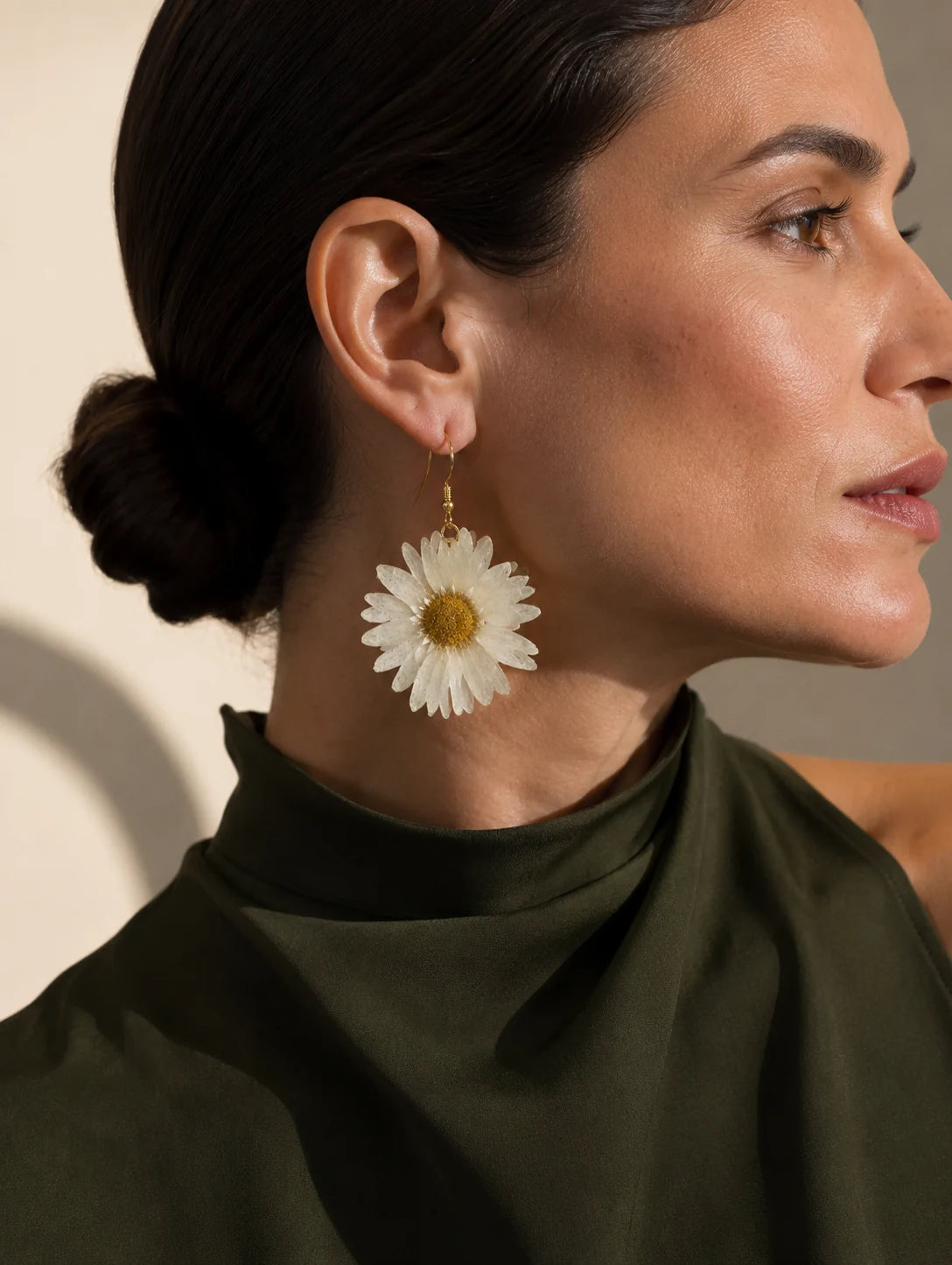 Editorial model styling the Large White Petal Drop Earrings