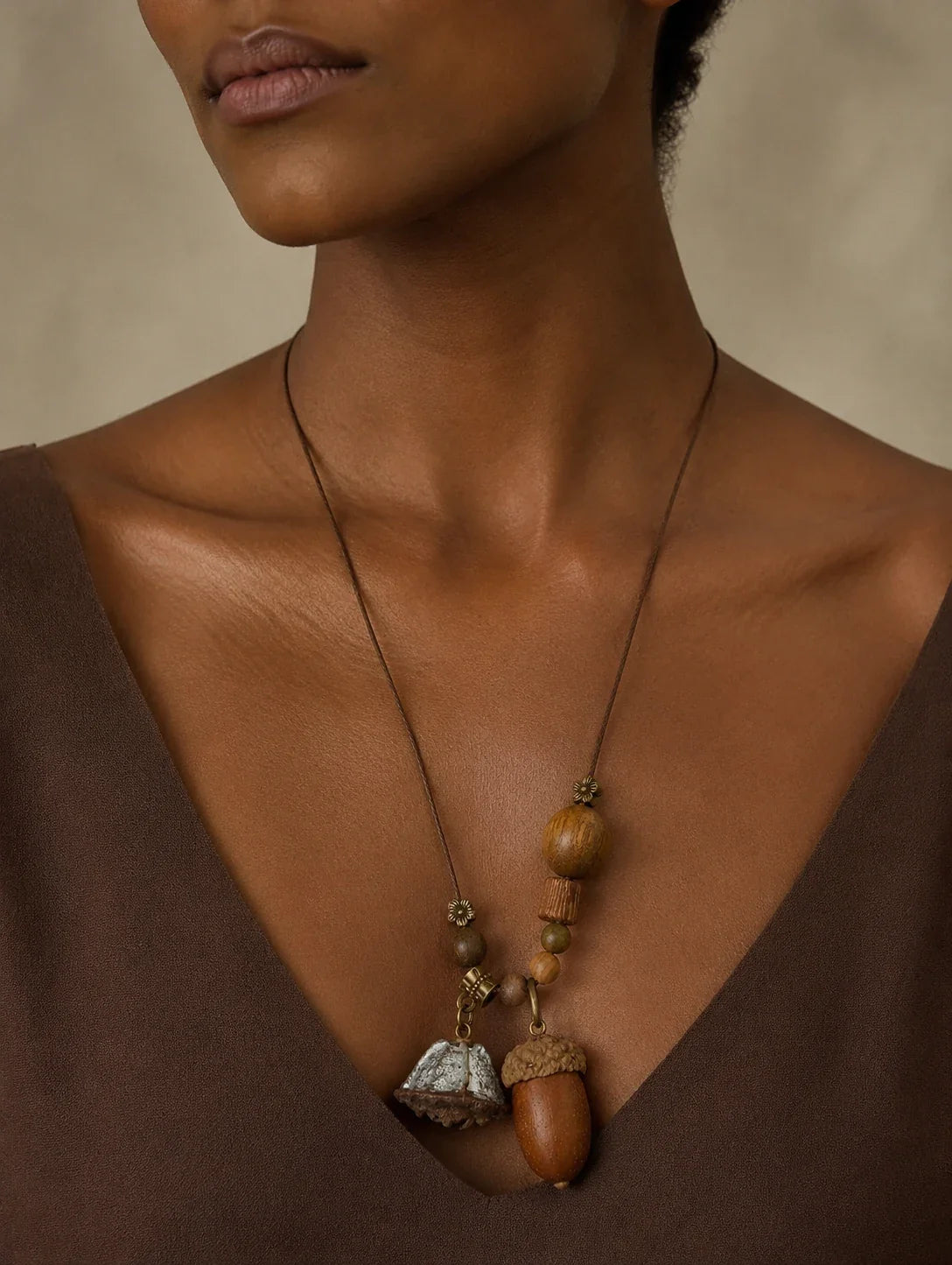 Editorial model styling the Long Acorn-Inspired Cluster Necklace