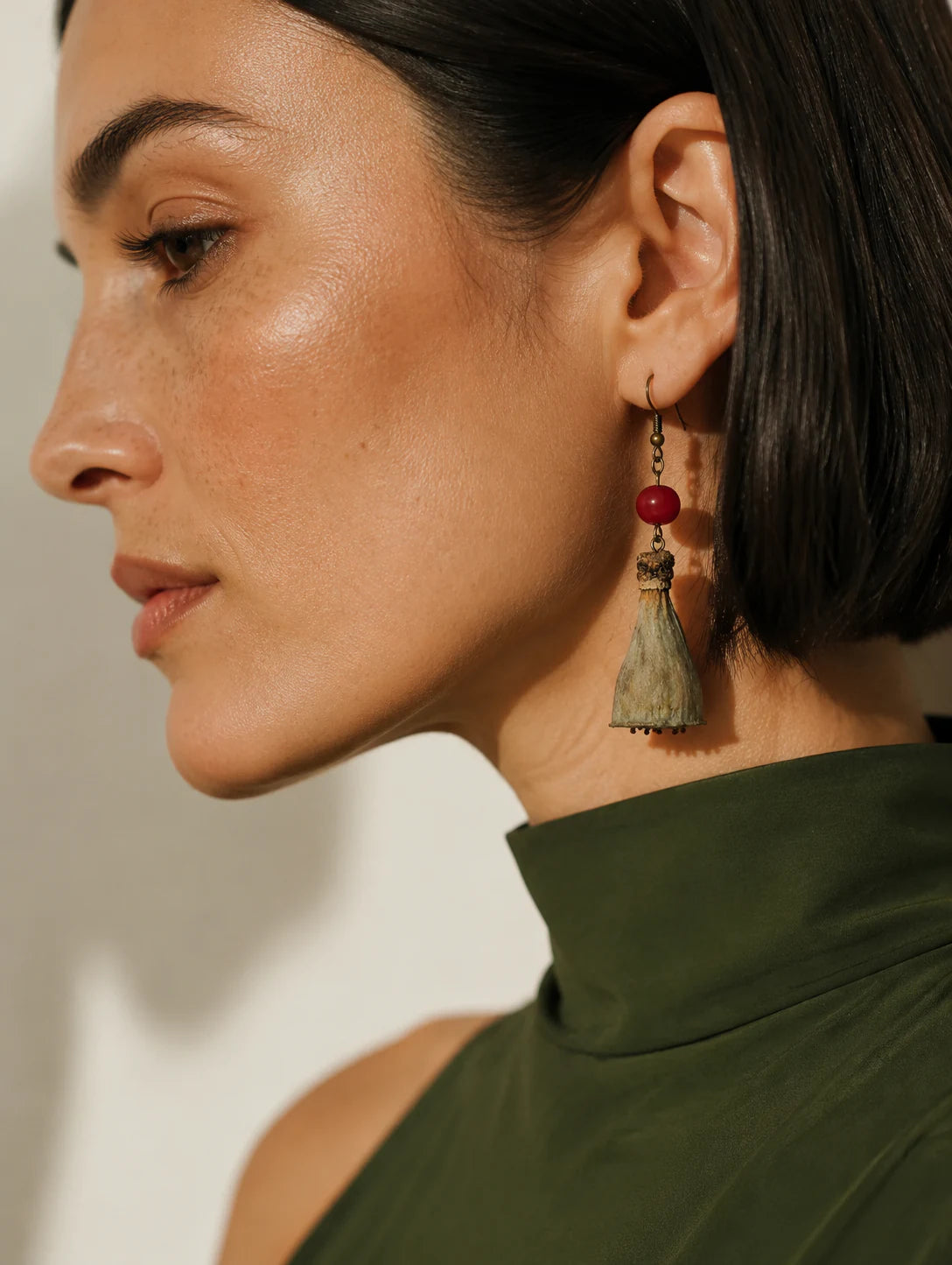 Editorial model styling the Seed-Pod and Red Bead Earrings