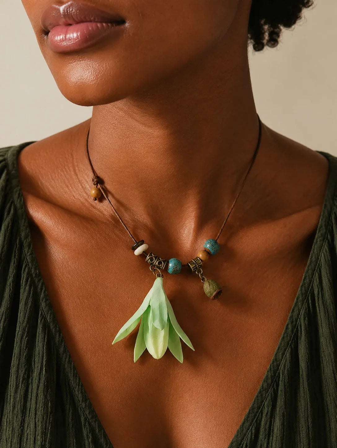 Editorial model styling the Mint Bell Petal Pendant Necklace