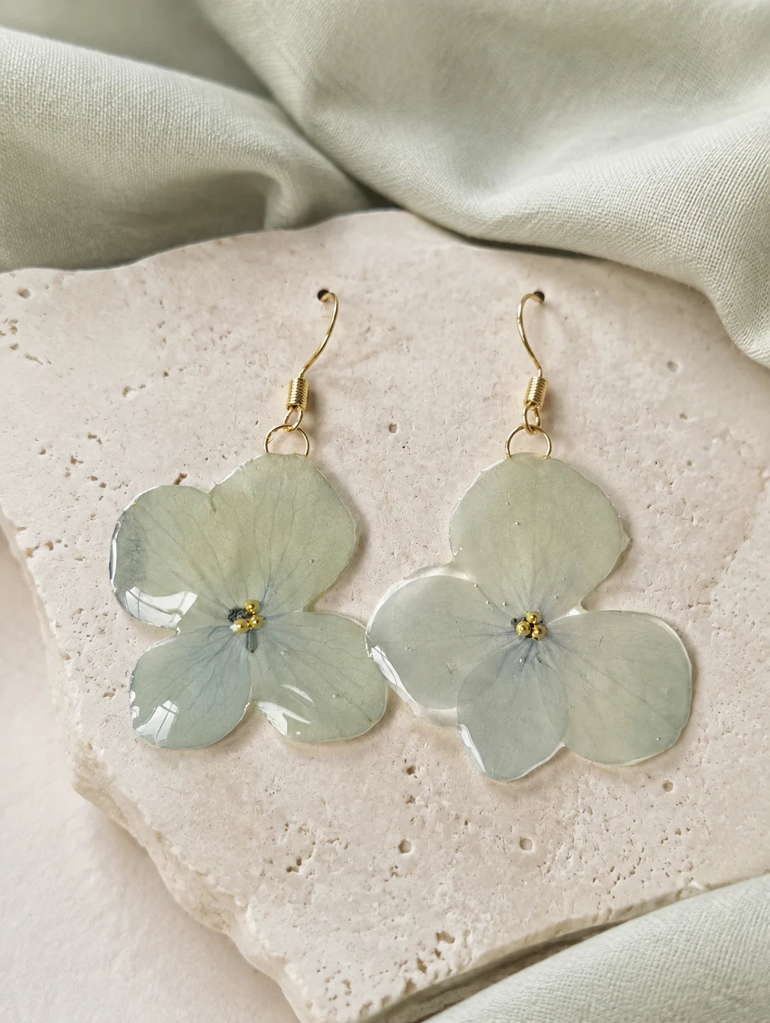 Pale Blue Cluster Petal Earrings — styled view