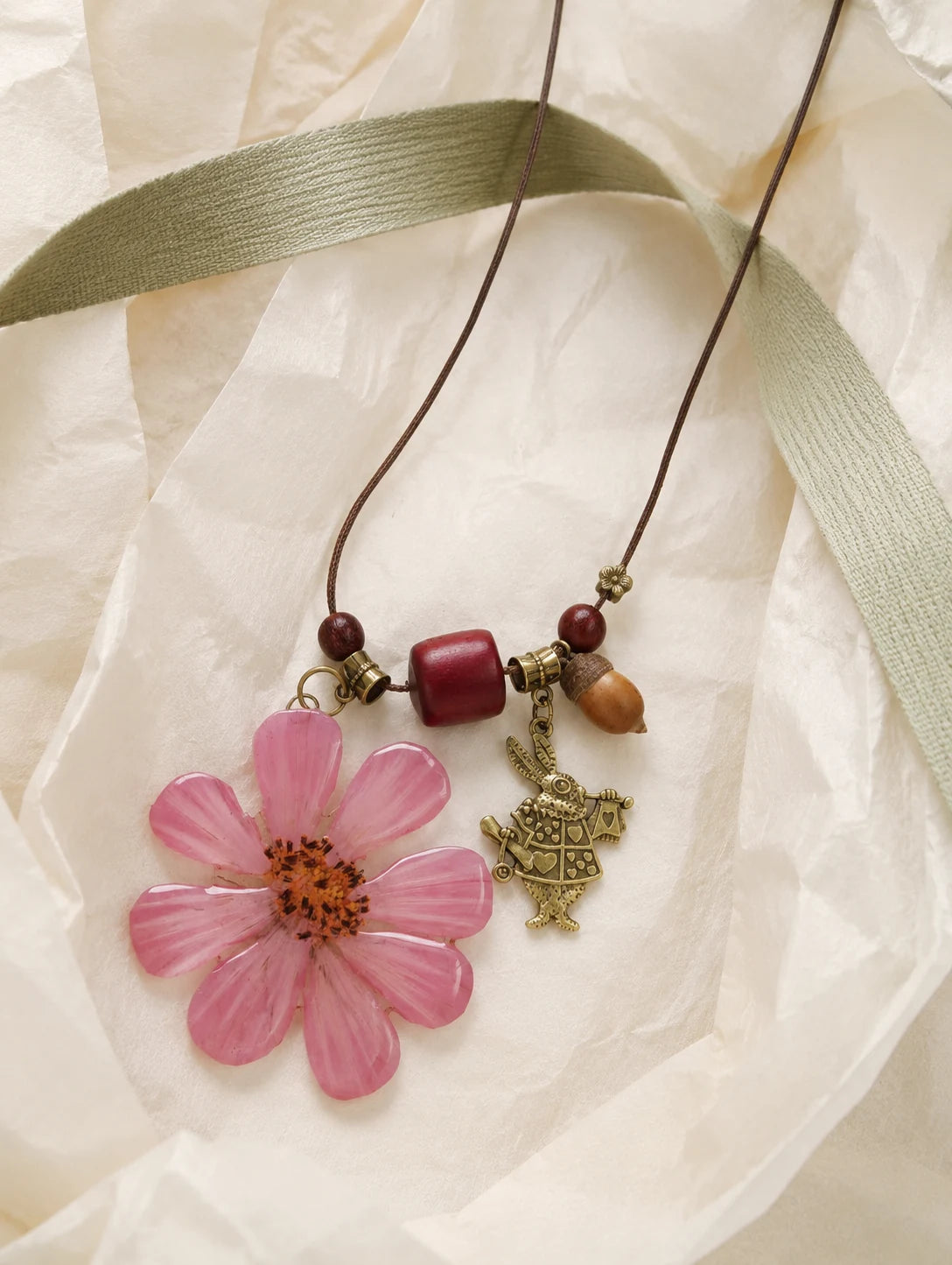 Pink Petal Pendant Necklace — unbranded gift-context still life