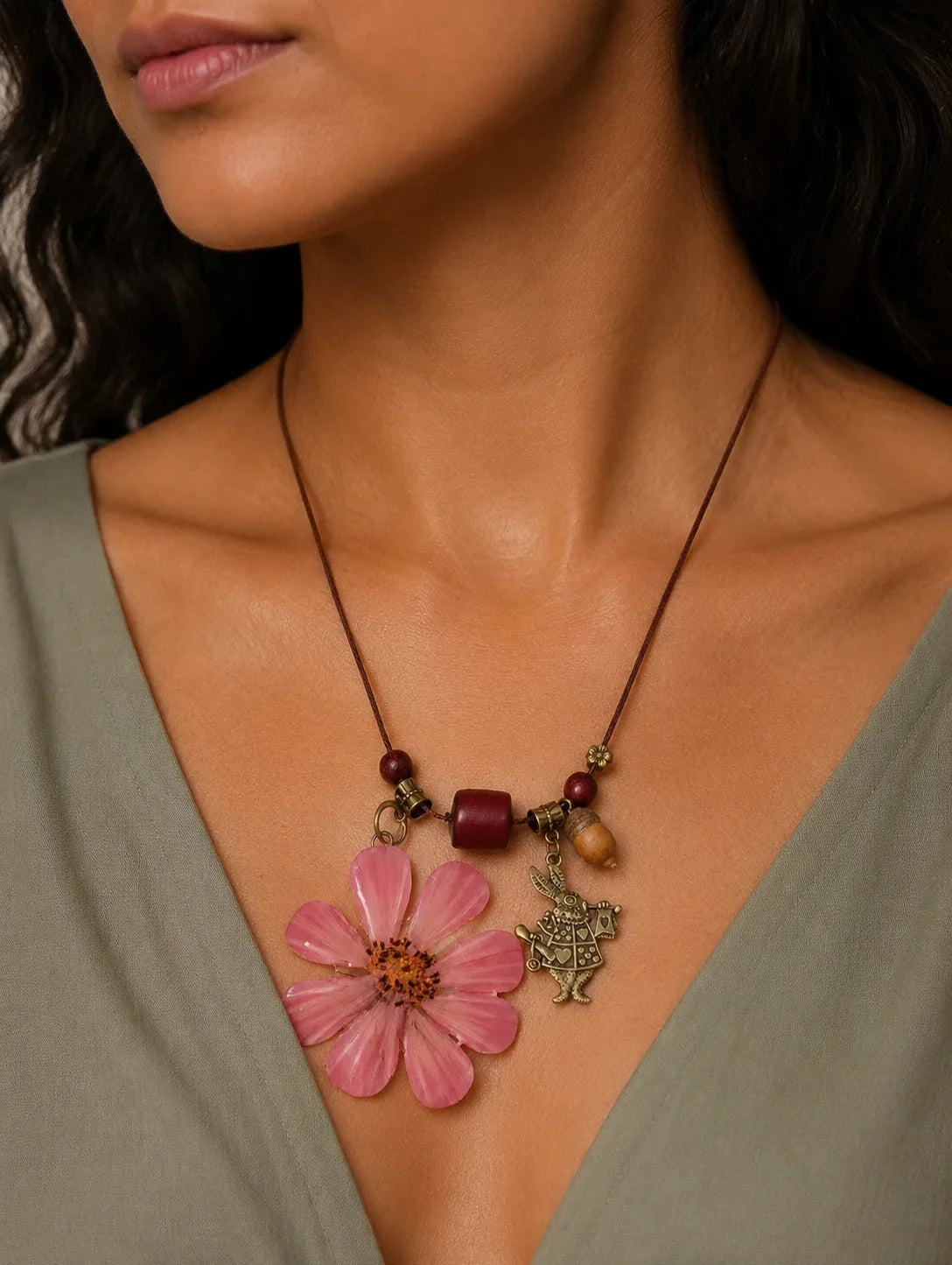 Editorial model styling the Pink Petal Pendant Necklace