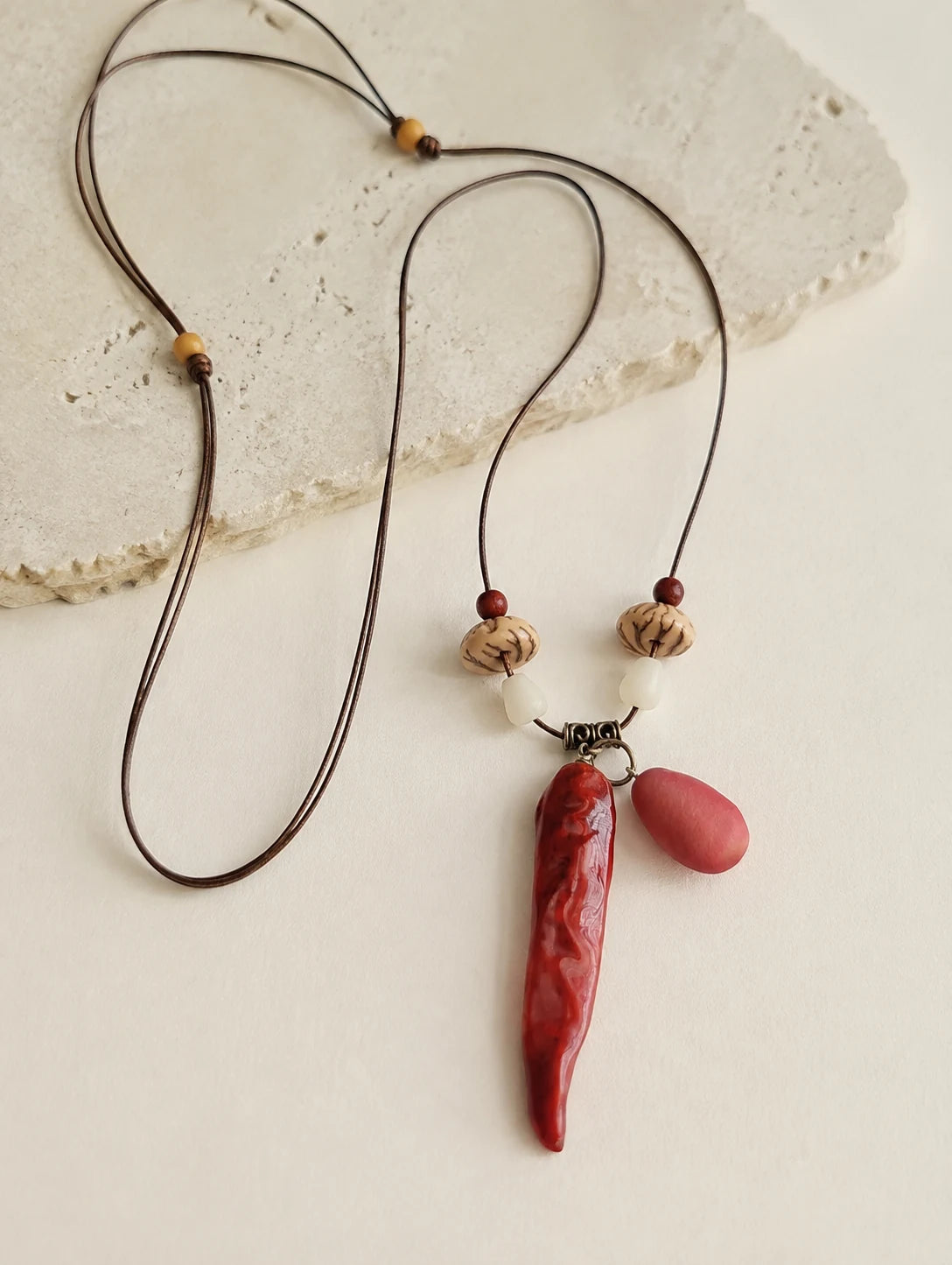 Red Pod and Bead Necklace — close detail view