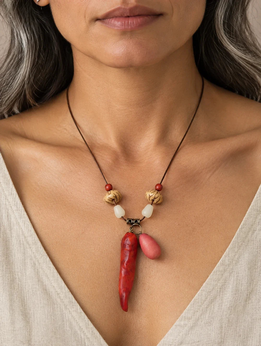 Editorial model styling the Red Pod and Bead Necklace
