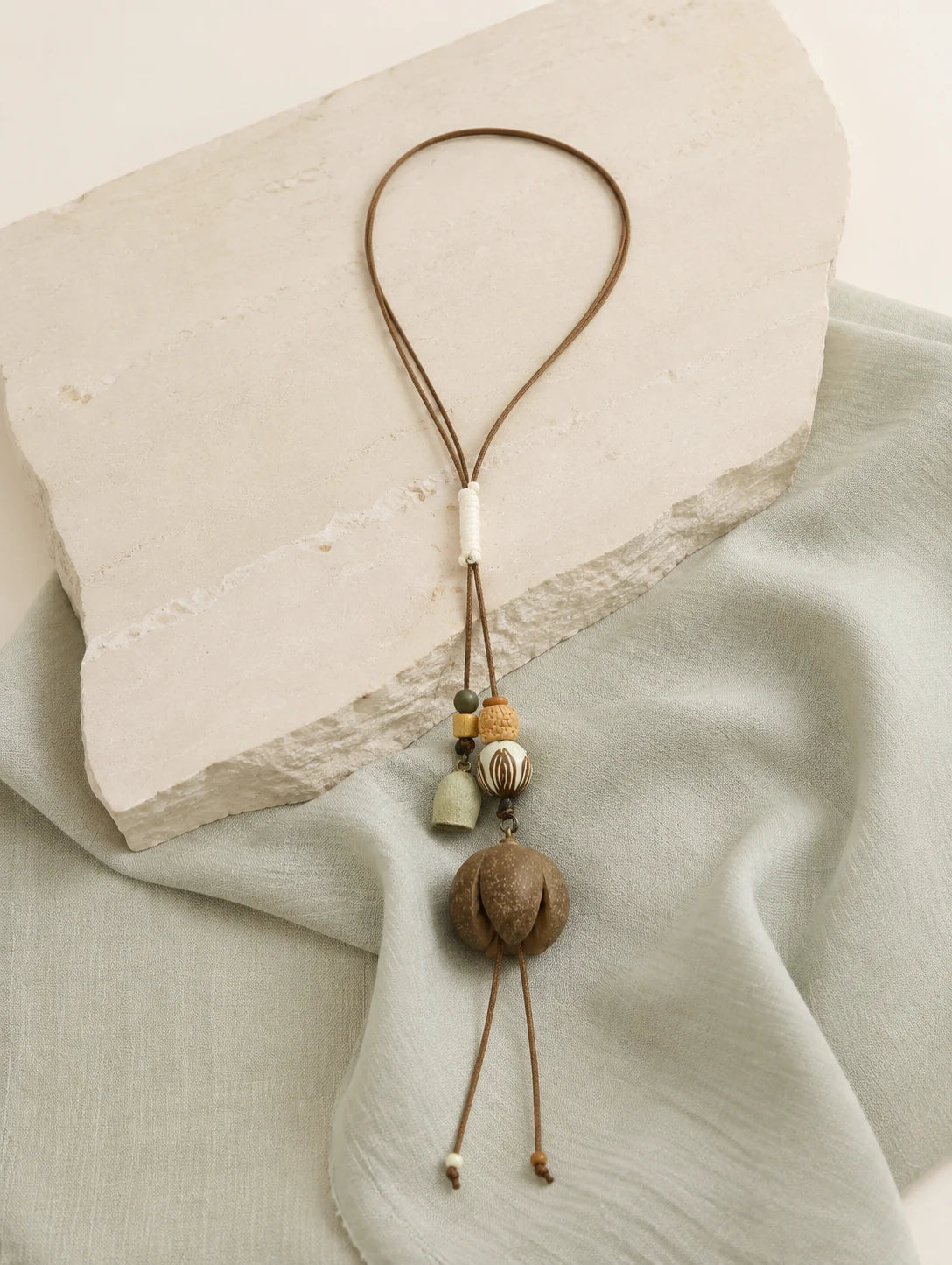 Round Woodland Pod Pendant Necklace — styled view