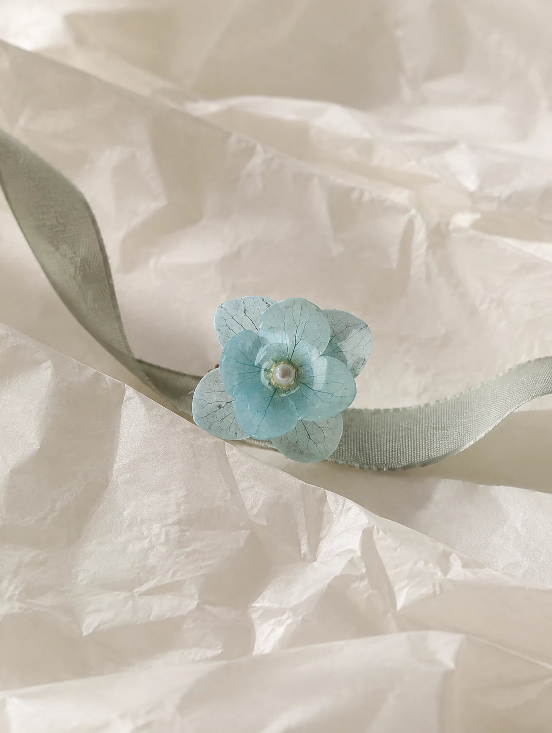 Sky Blue Petal Cluster Ring — unbranded gift-context still life