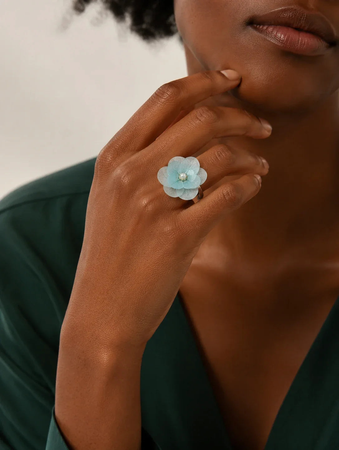 Editorial model styling the Sky Blue Petal Cluster Ring