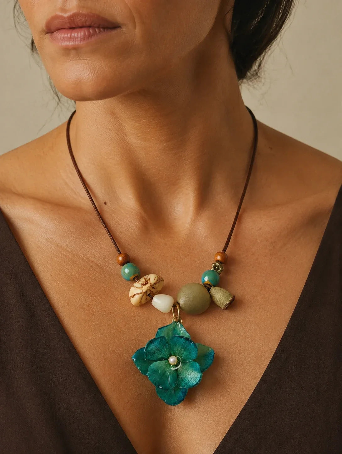 Editorial model styling the Teal Petal Cluster Necklace