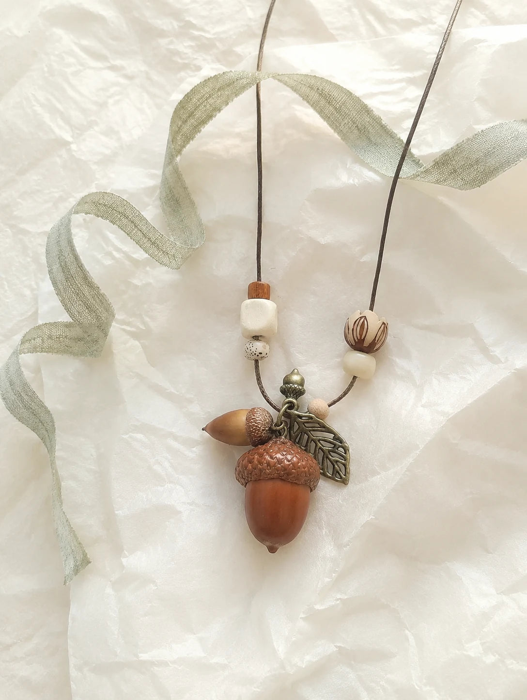 Woodland Acorn Cluster Necklace — unbranded gift-context still life