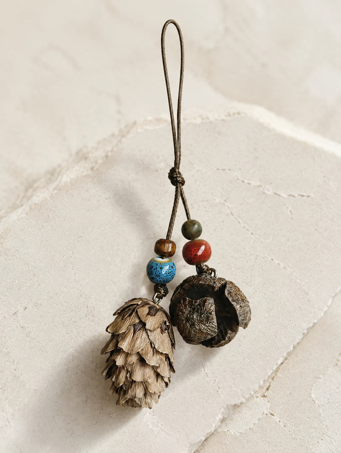 Woodland Cone and Seed Phone Charm — hero view