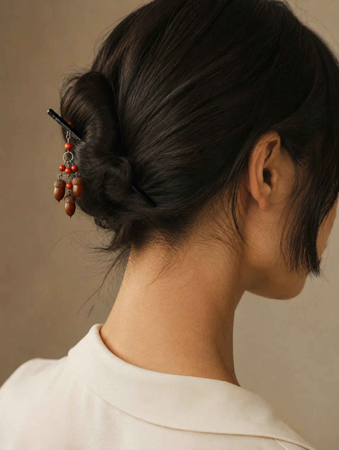 Editorial model styling the Woodland Seed Tassel Hair Stick