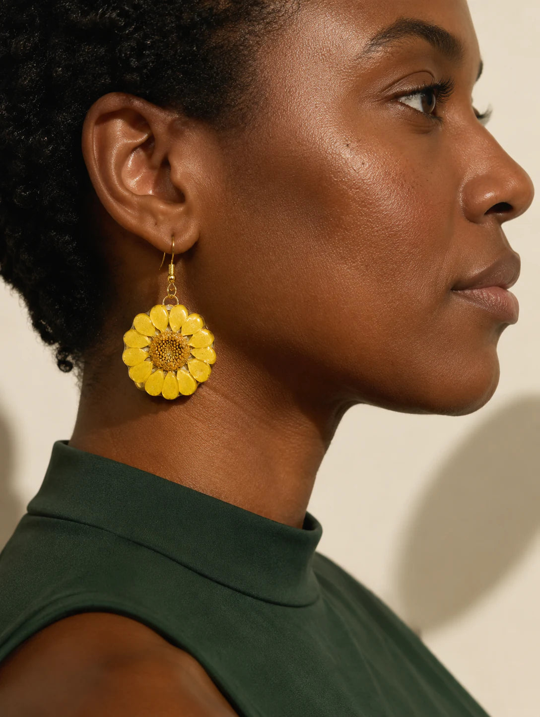 Editorial model styling the Yellow Round-Leaf Petal Earrings