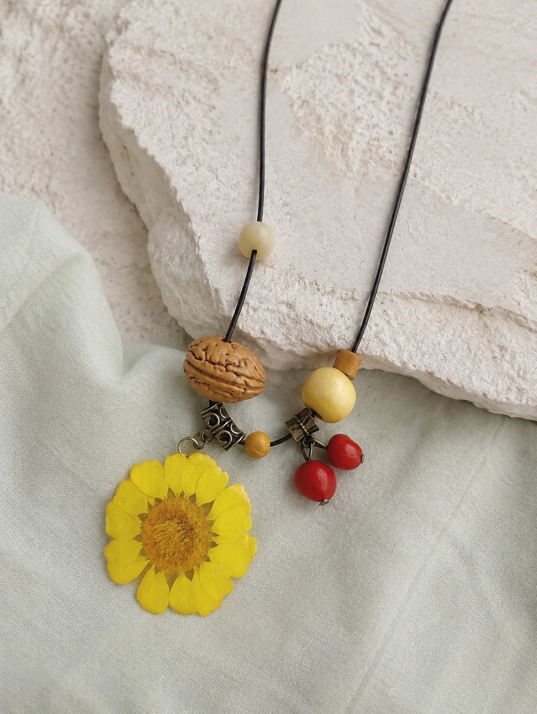 Yellow Round Petal Necklace — restrained editorial still life