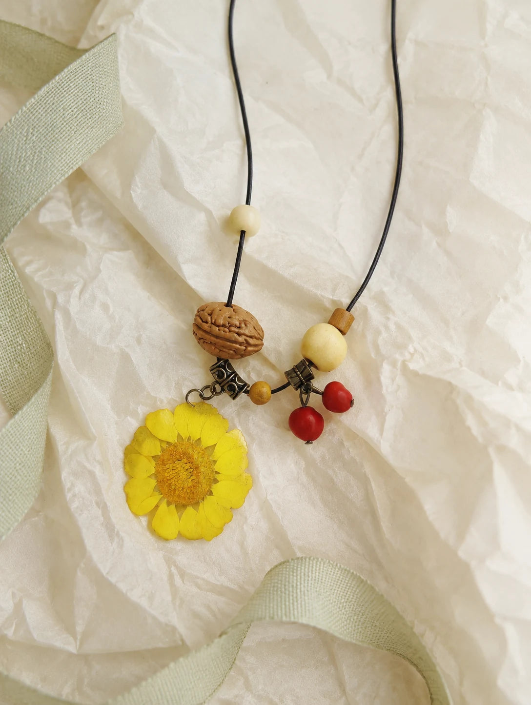 Yellow Round Petal Necklace — unbranded gift-context still life
